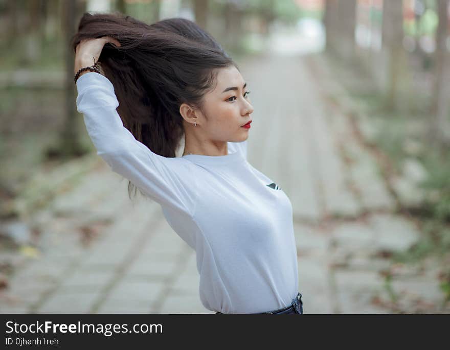 Woman Wearing Grey Crew Neck Long Sleeve Shirt