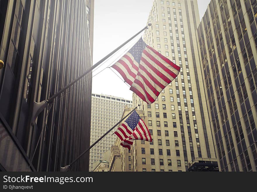 Two U.s.a. Flags Under White Clouds at Daytime