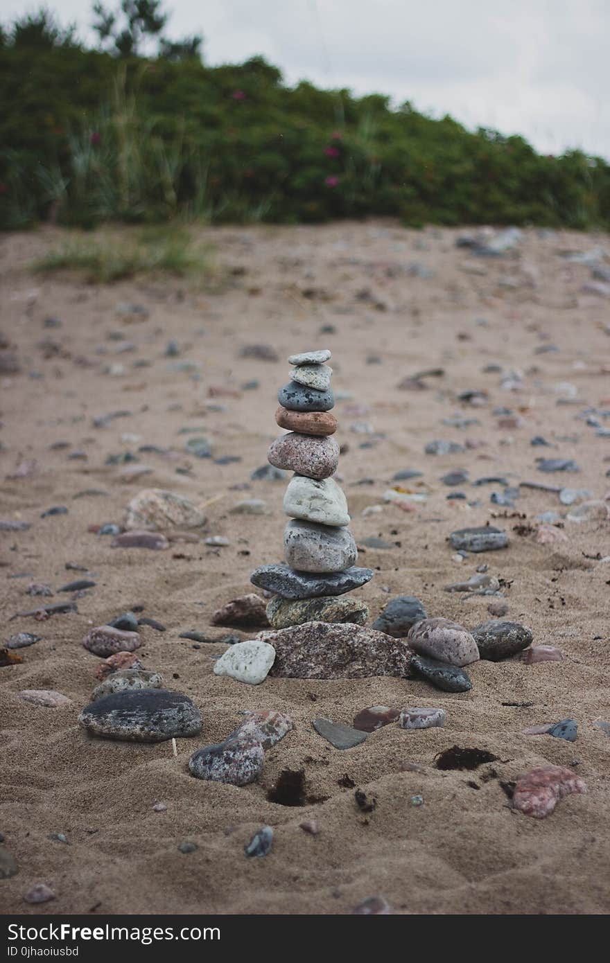 Stack of Stones on the Middle of Brown Soil