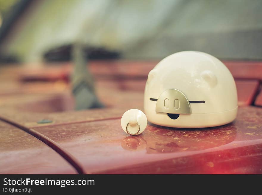 Shallow Focus Photography of White Ceramic Piggy Bank