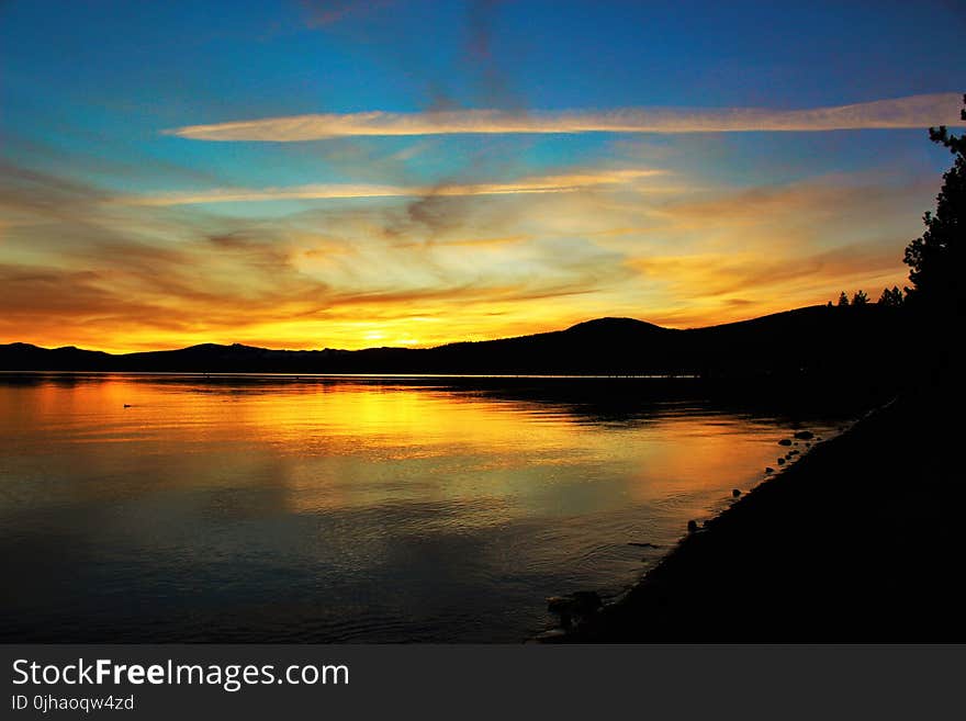 Large Body of Water during Sunset