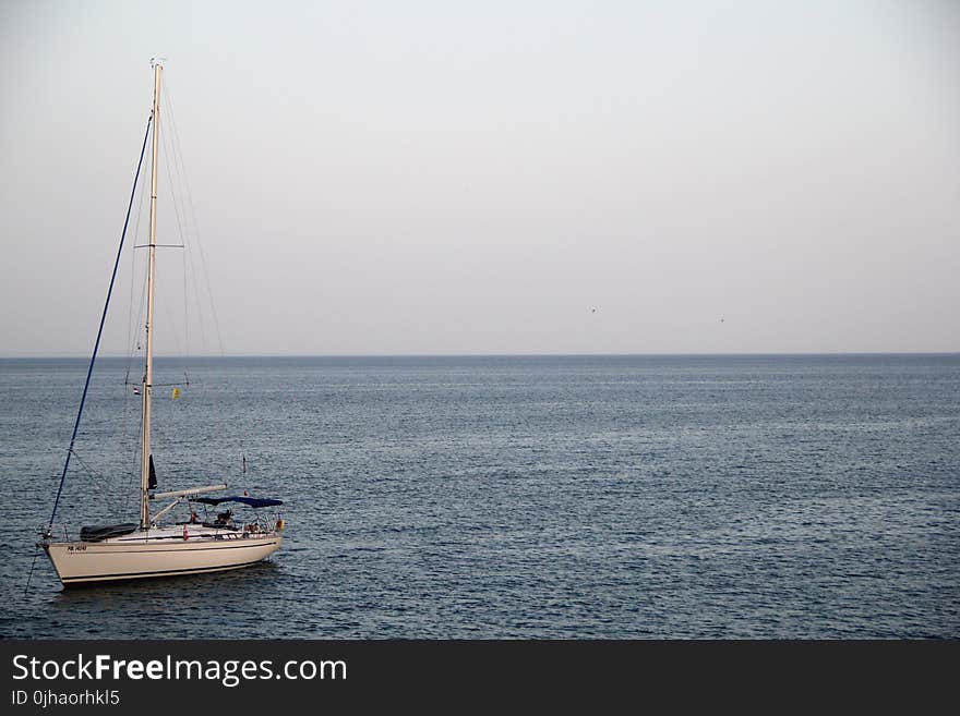 White Yacht on Ocean during Cloufy Day