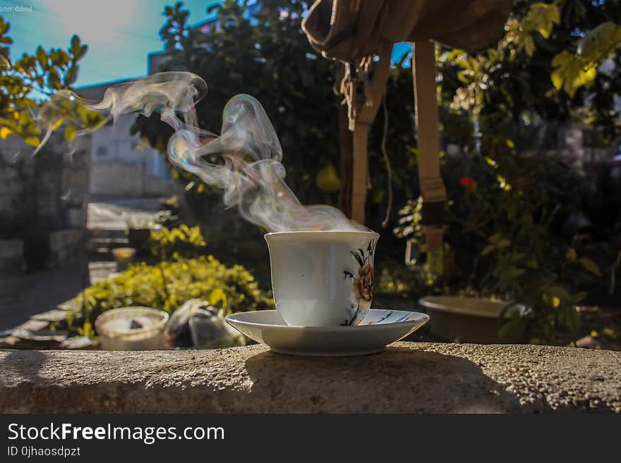 Close-Up Photo of Ceramic Cup With Saucer