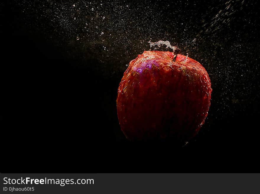 Time Lapse Photography Of Falling Red Apple