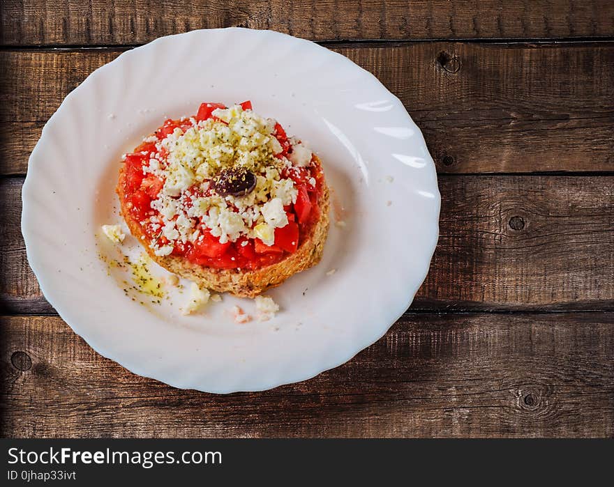 Pastry With Cream in Ceramic Saucer