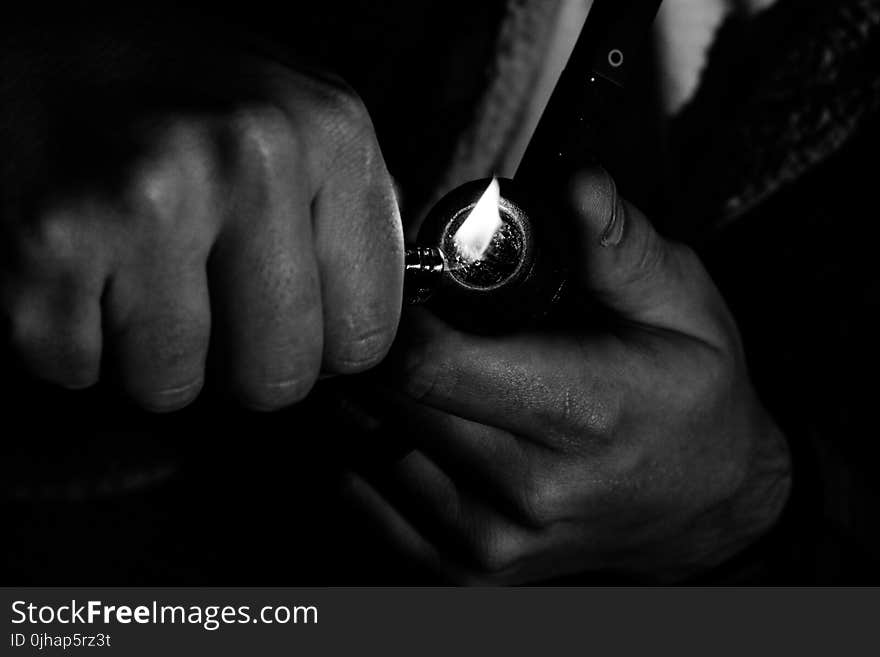 Photo of Man Holding Lighter