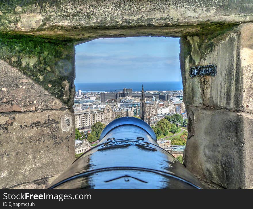 Selective Focus Photography of Cannon and Buildings