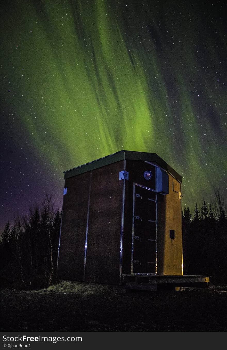 Photo of Wooden Shed Under Northern Lights