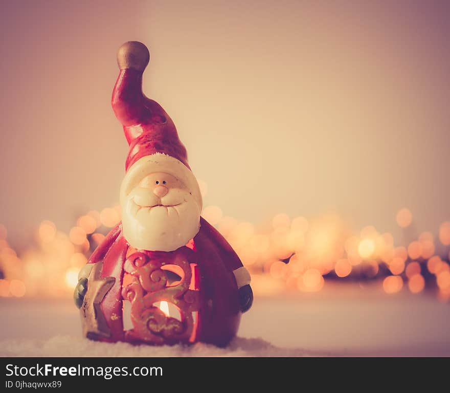 Shallow Focus Photography of Santa Claus Figurine