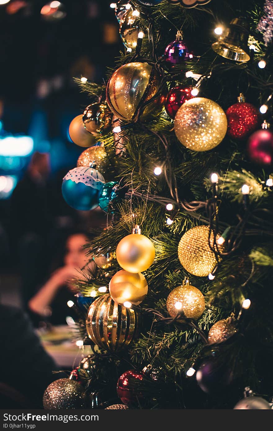 Green and Gold-colored Lighted Christmas Tree