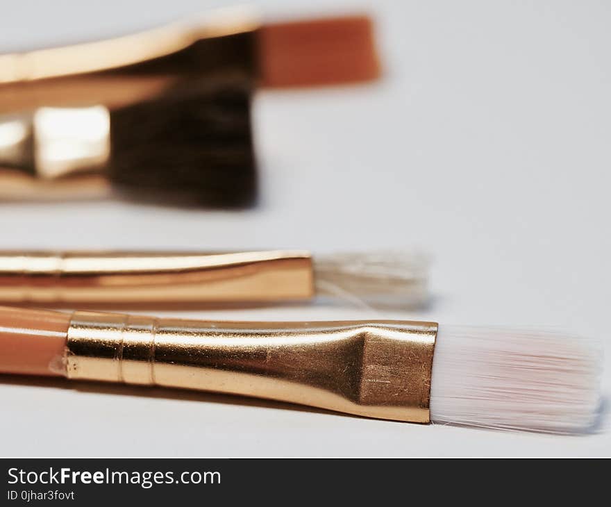 Selective Focus Photography of Brown Makeup Brush Kit