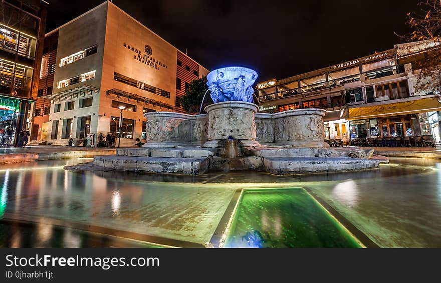 Blue and Gray Water Fountain Near Buildings