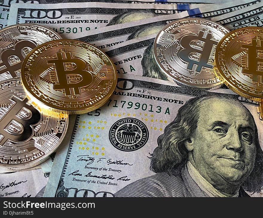 Bitcoins and U.s Dollar Bills