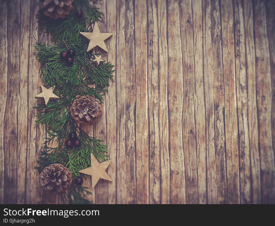 Photo of Brown Wooden Board With Green Floral Wreath