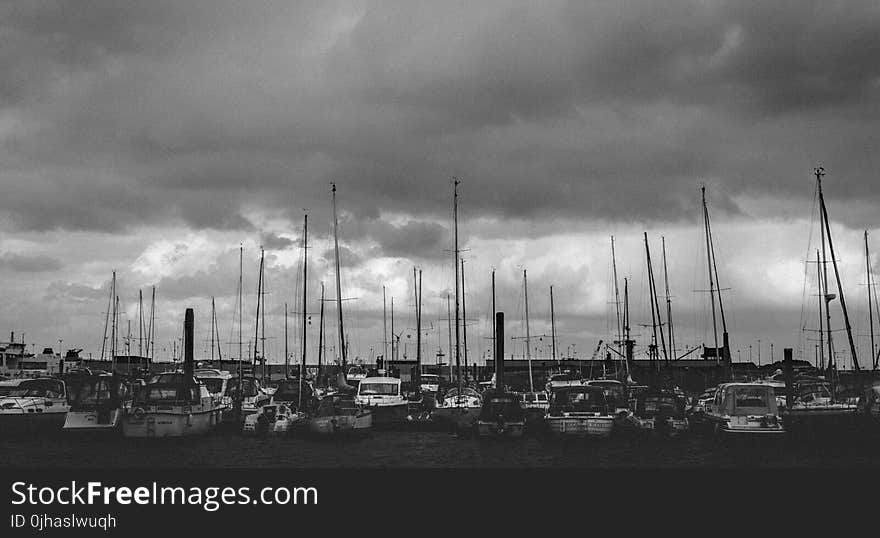 Gray Scale Photo of Group of Boats