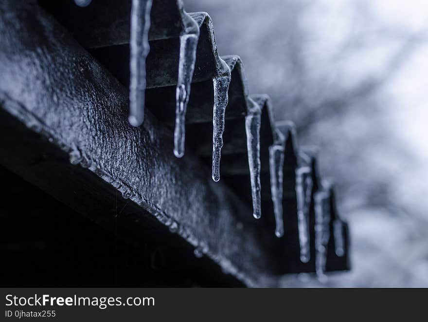 Close-up Photography of Ice Crystals on Edges of Corrugated Sheets