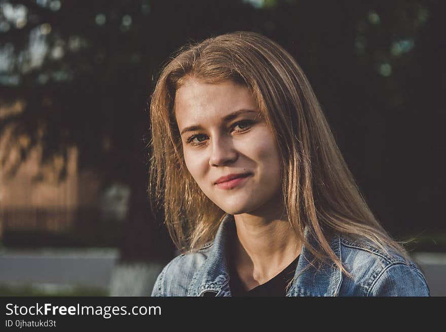 Woman Wearing Blue Denim Jacket