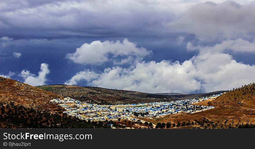 Aerial Photo of Mountain and City