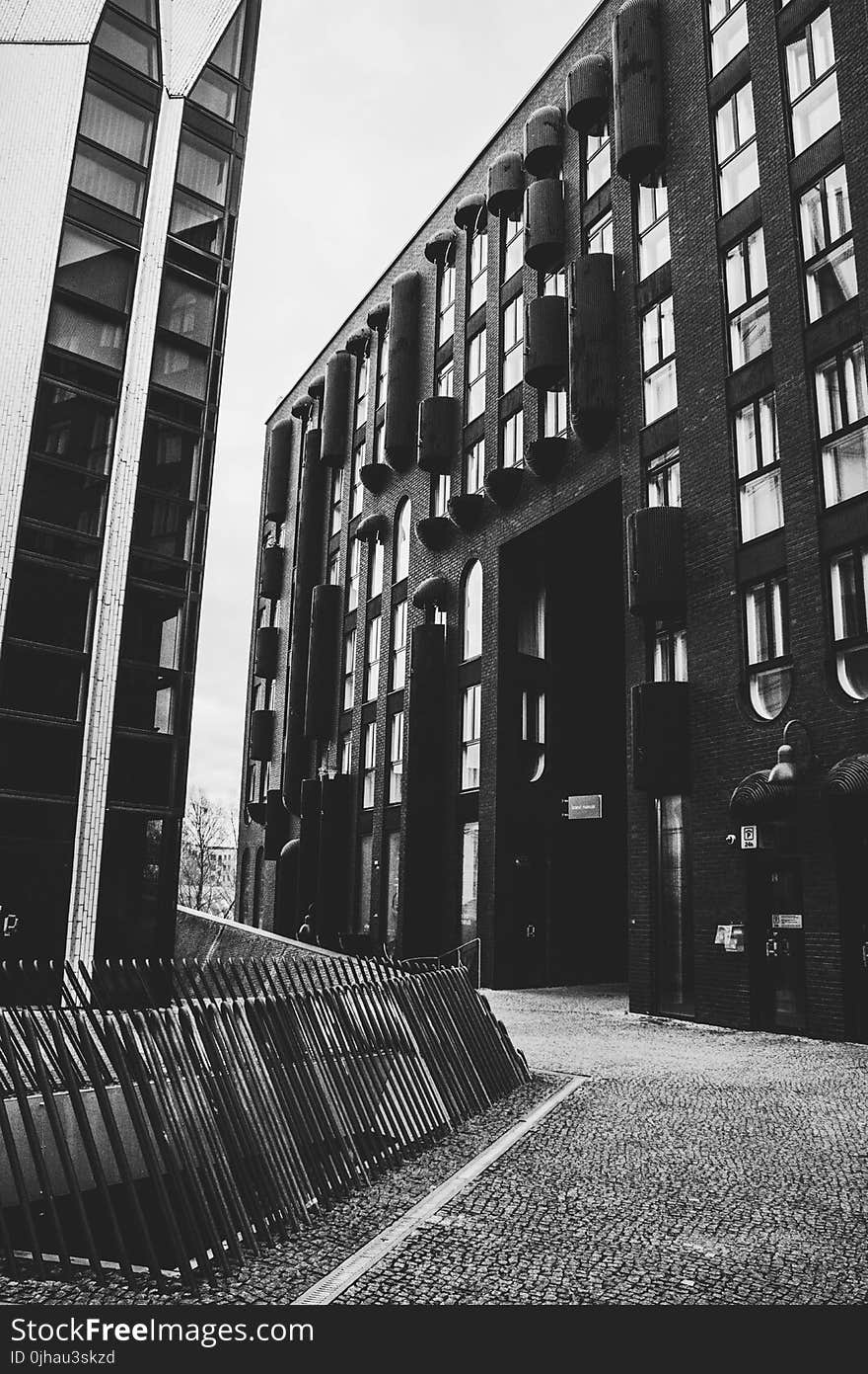 Grayscale Photo of Concrete Buildings