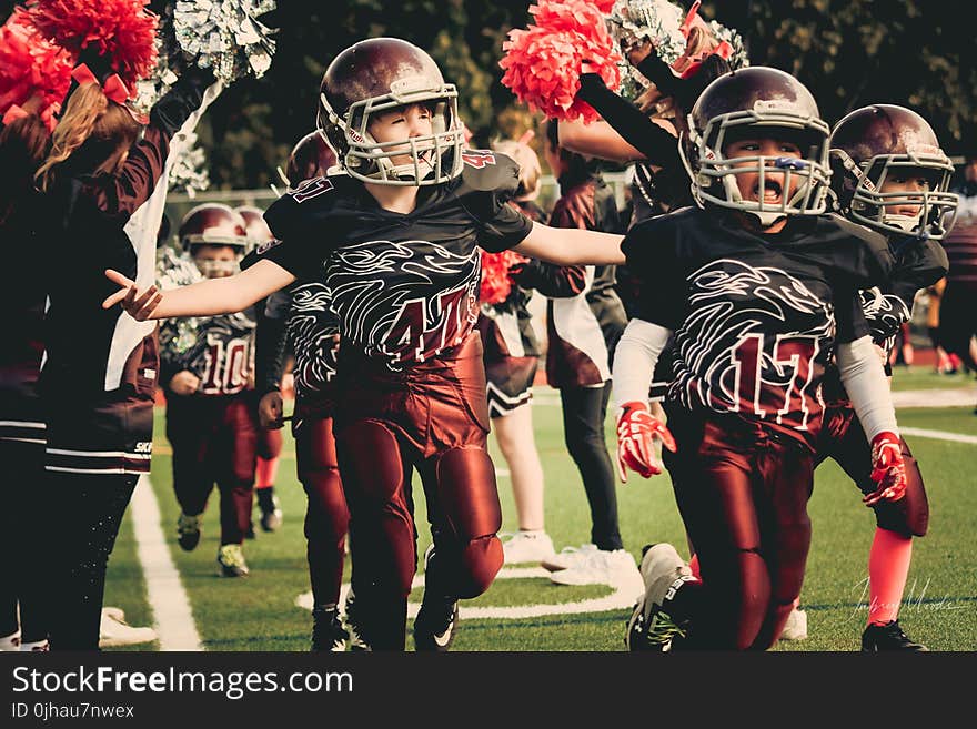 Children in White and Red Football Outfit