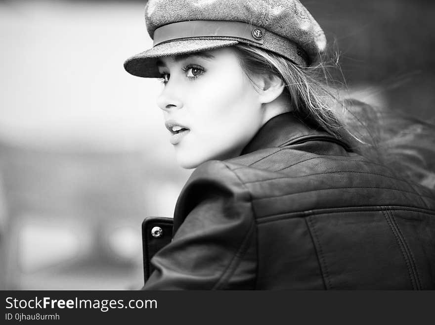 Grayscale Photo of Woman in Black Leather Jacket