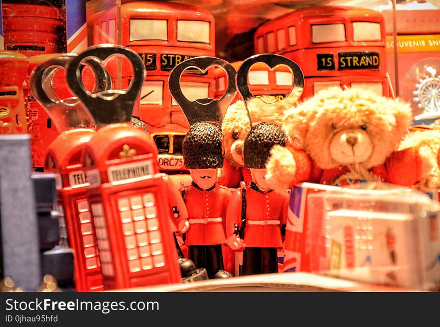 Brown Teddy Bear Near Red Miniature Telephone Booth