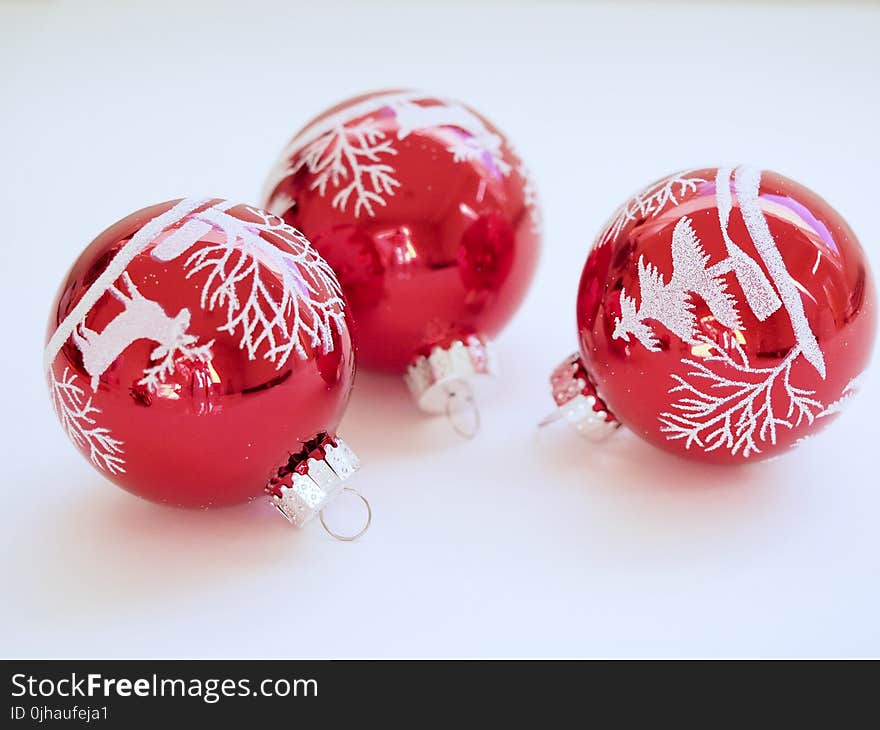 Three White-and-red Christmas Tree Printed Baubles