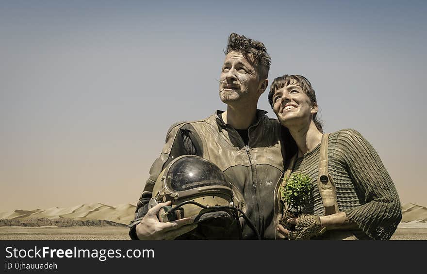 Photo of Man and Woman Looking at the Sky