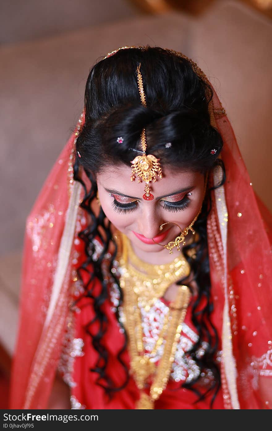 Woman Wearing Red and White Sari