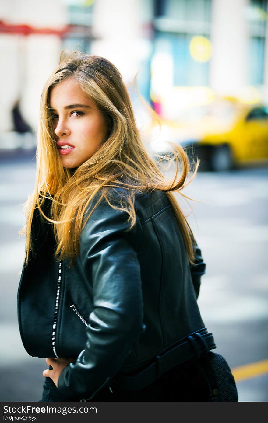 Woman Wearing Black Leather Jacket Facing Backward