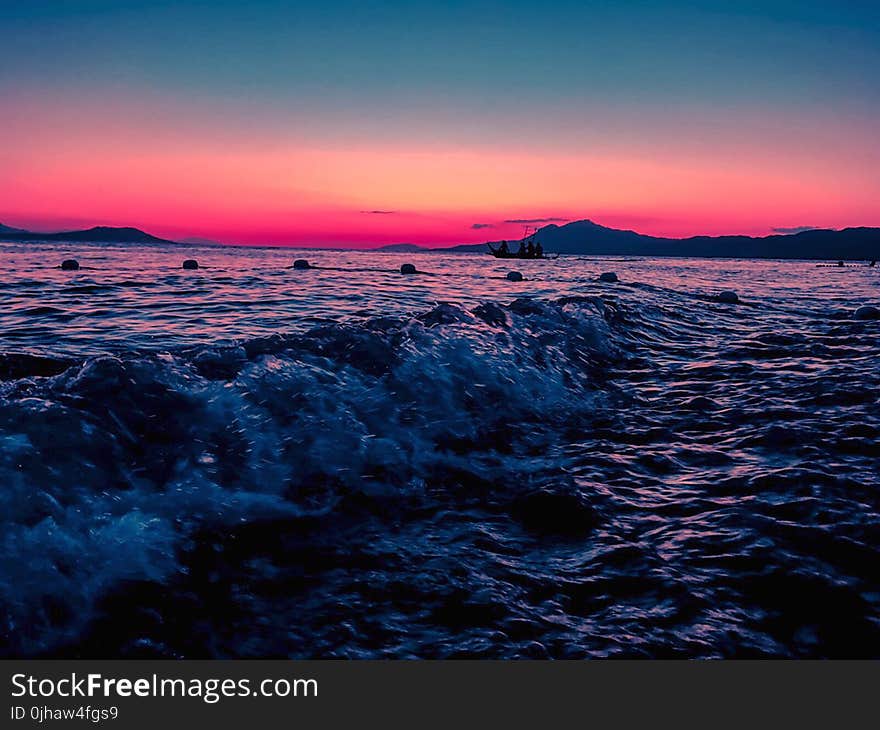 Person Taking Photo of Body of Water in Long Exposure Shot