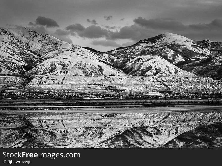 Grayscale Photo of a Landscape View of Mountains