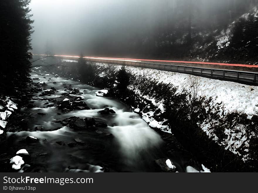 Time Lapse Photo of River Beside Highway during Cloudy Weather