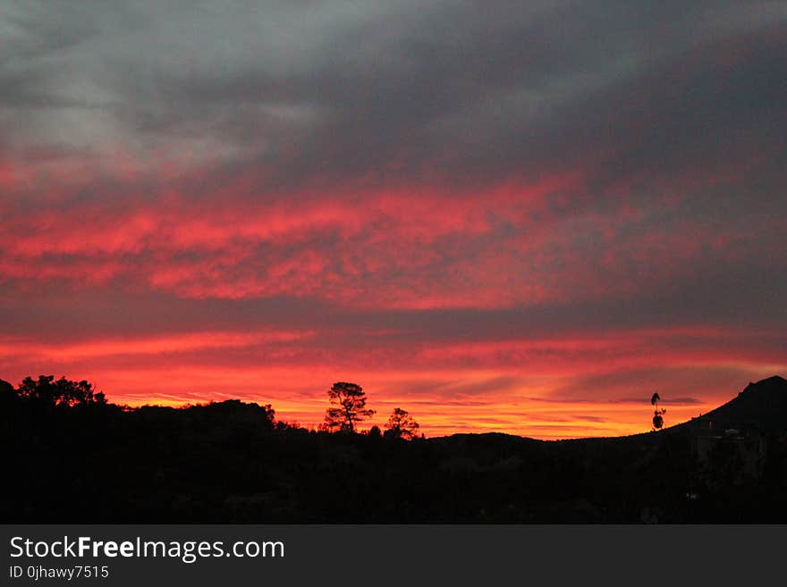 Mountain Under Red and Gray Cloudy Sky during Golden Hou