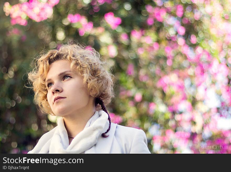 Photo of a Woman Wearing White Coat