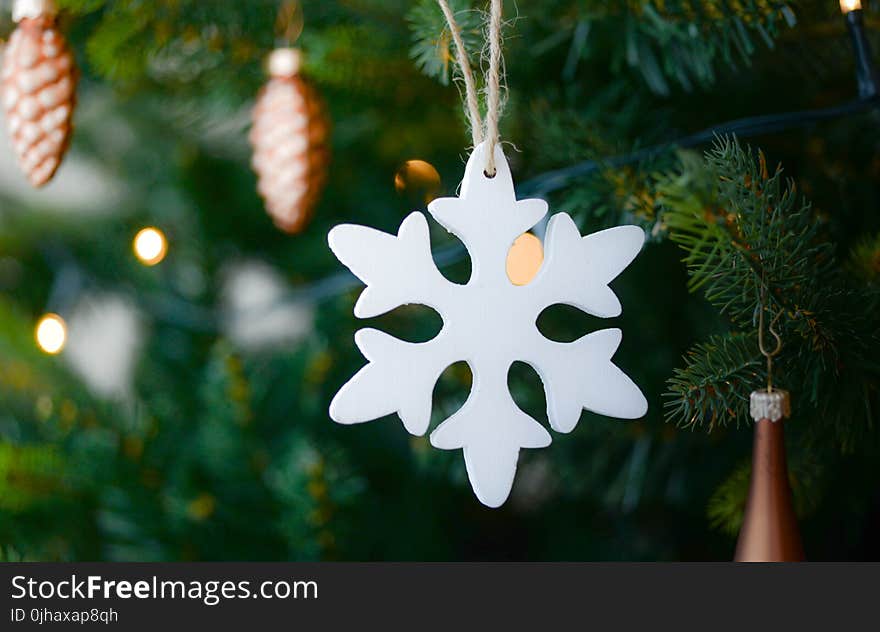 White Snow Flake Hanging on Christmas Tree