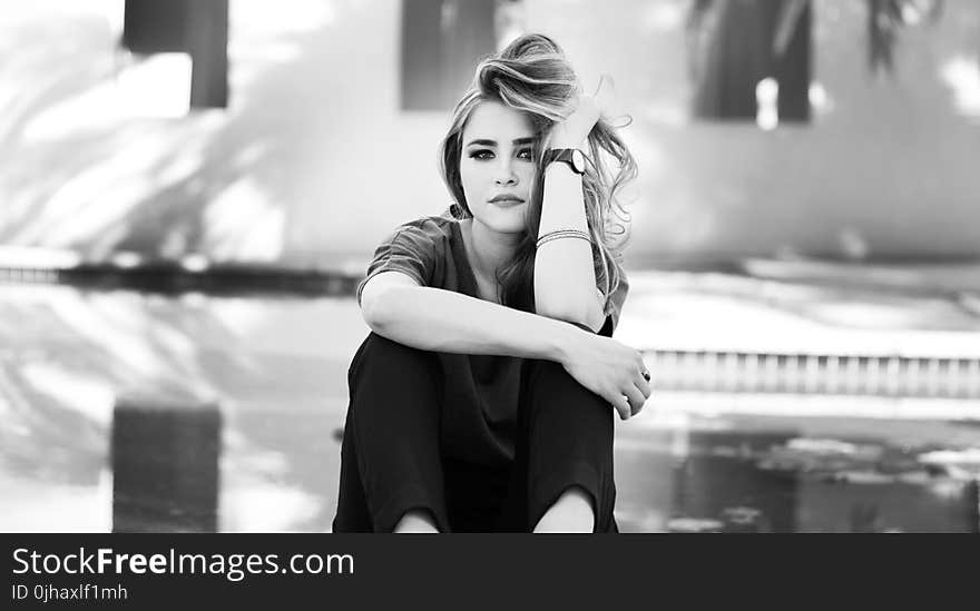 Black and White Photo of Woman in Crew-neck Shirt and Pants