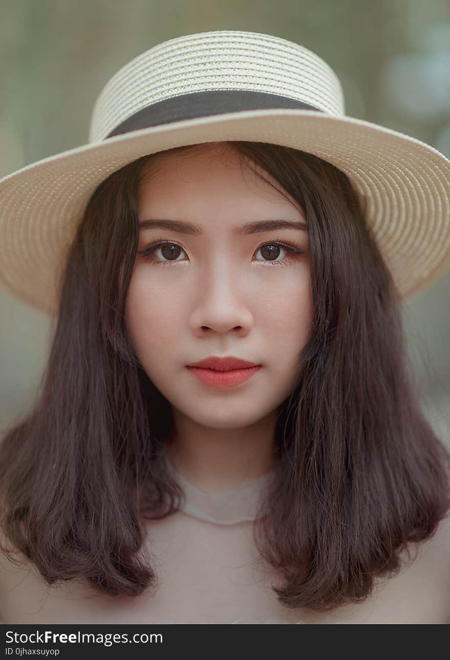 Woman Wearing Brown Bucket Cap