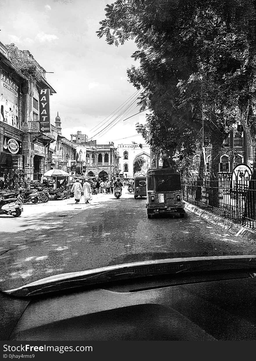 Grayscale Photography of People Walking Near Buildings