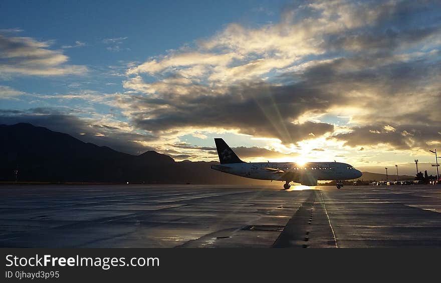 Silhouette of Airplane in Golden Hour