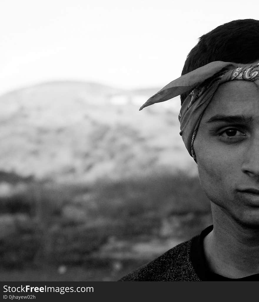 Grayscale Photography of Man Wearing Bandana