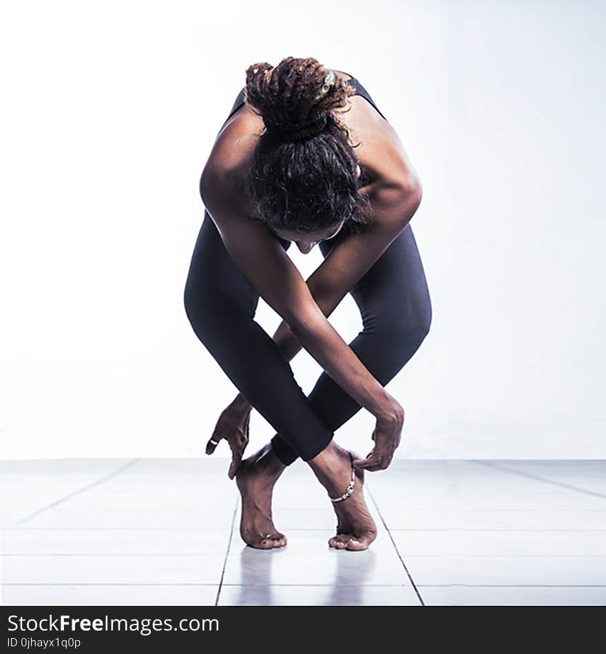 Woman in Black Pants Doing Yoga