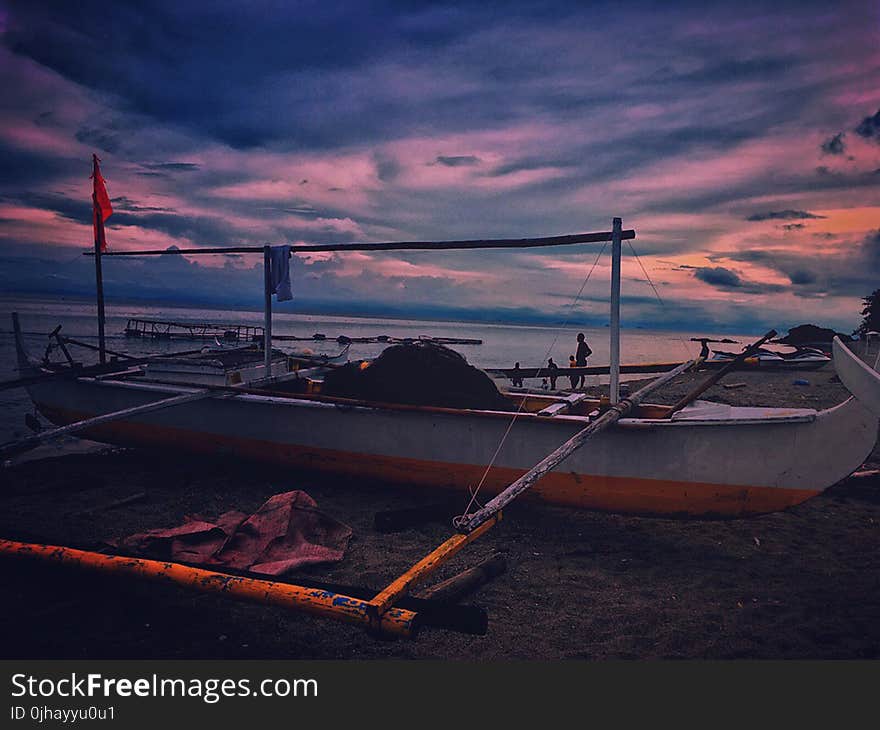 White Fishing Boat during Dawn