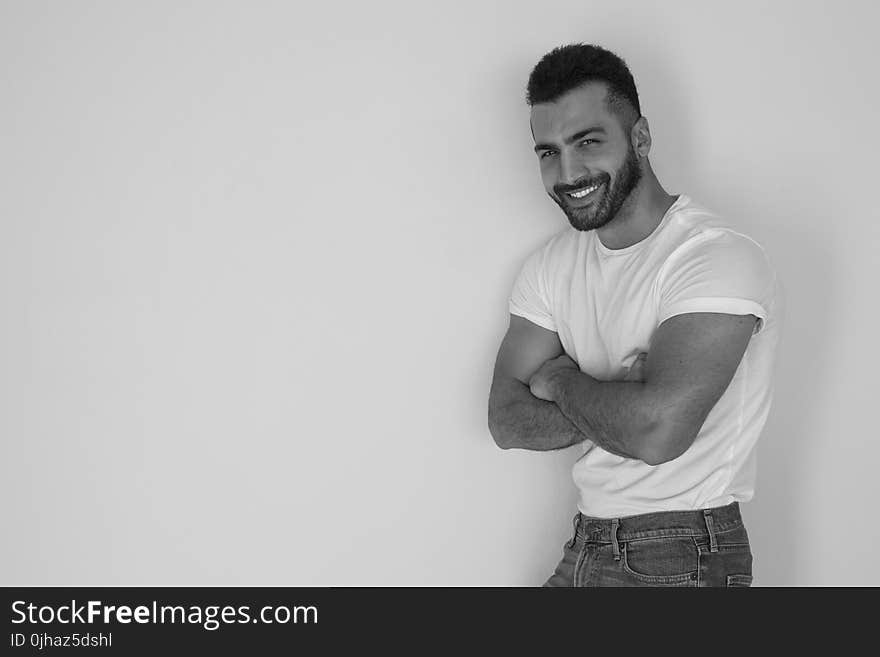 Black and White Photo of a Man Wearing White Shirt