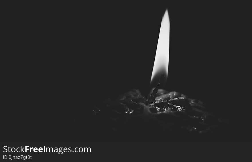 Lighted Candle Gray Scale Photo