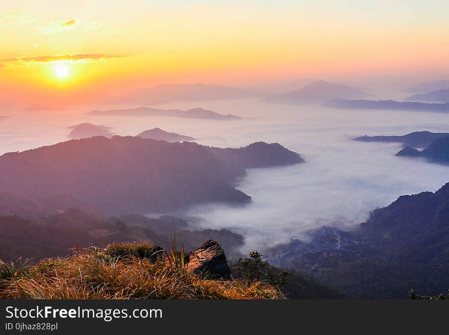 Sun Rise With Mountain and Green Grass