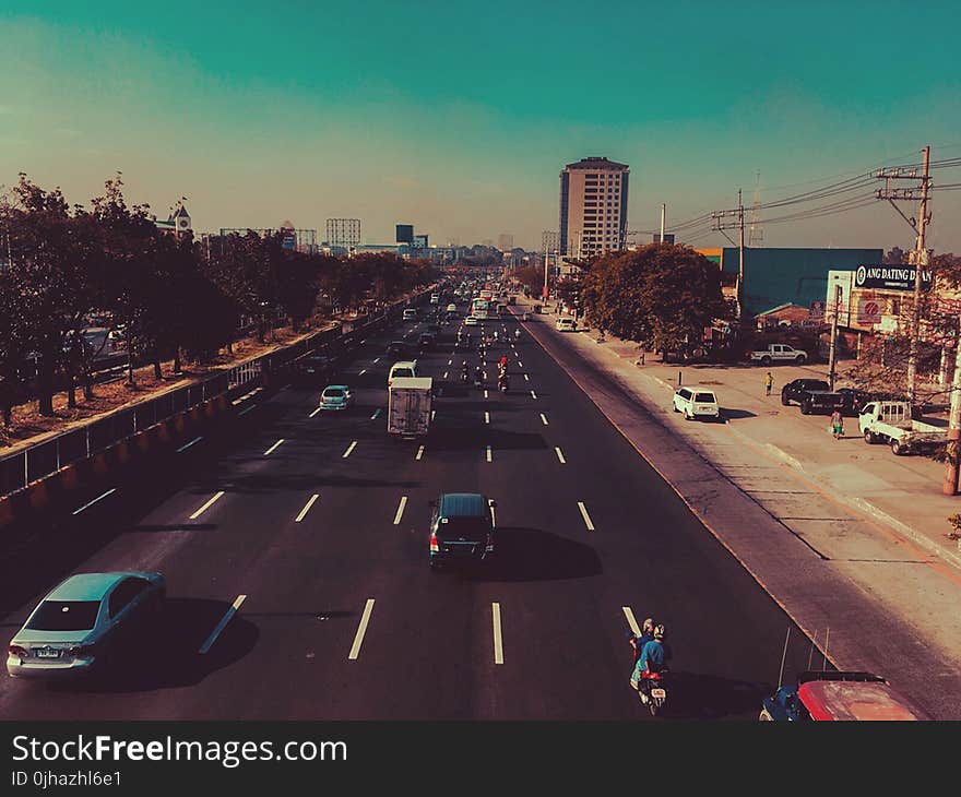 Cars in Black Concrete Road in Landscape Photography