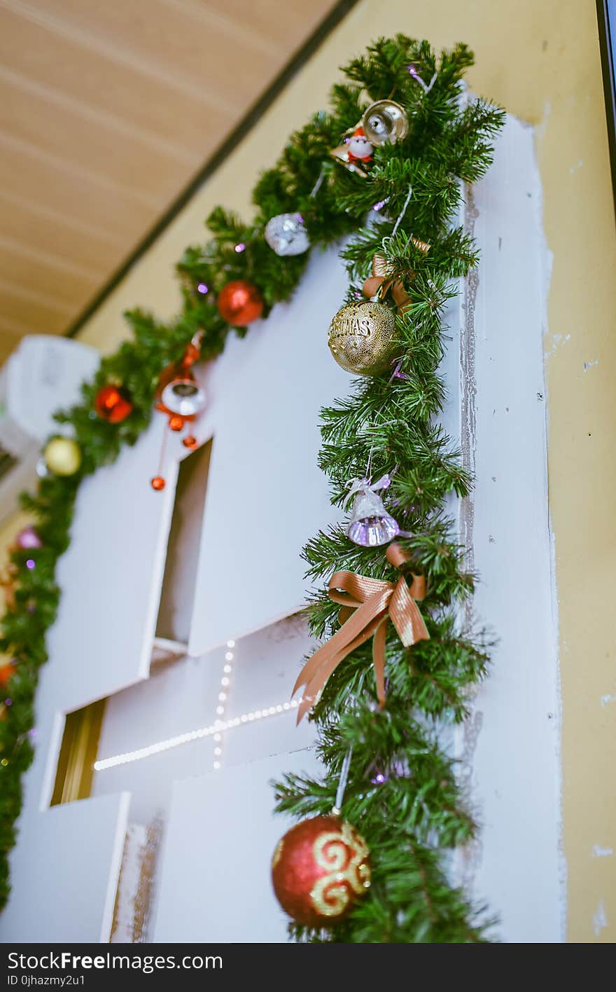 Photo of Green Garland With Bold Bauble Decor