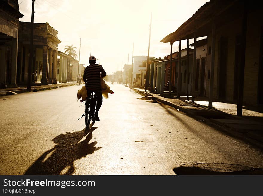 Person Riding on Bike Photo Shot during Daylight