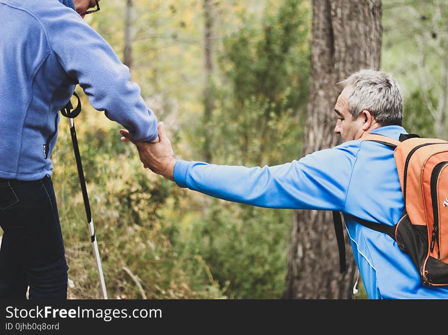 Photo of Two Old Man Helping Each Other